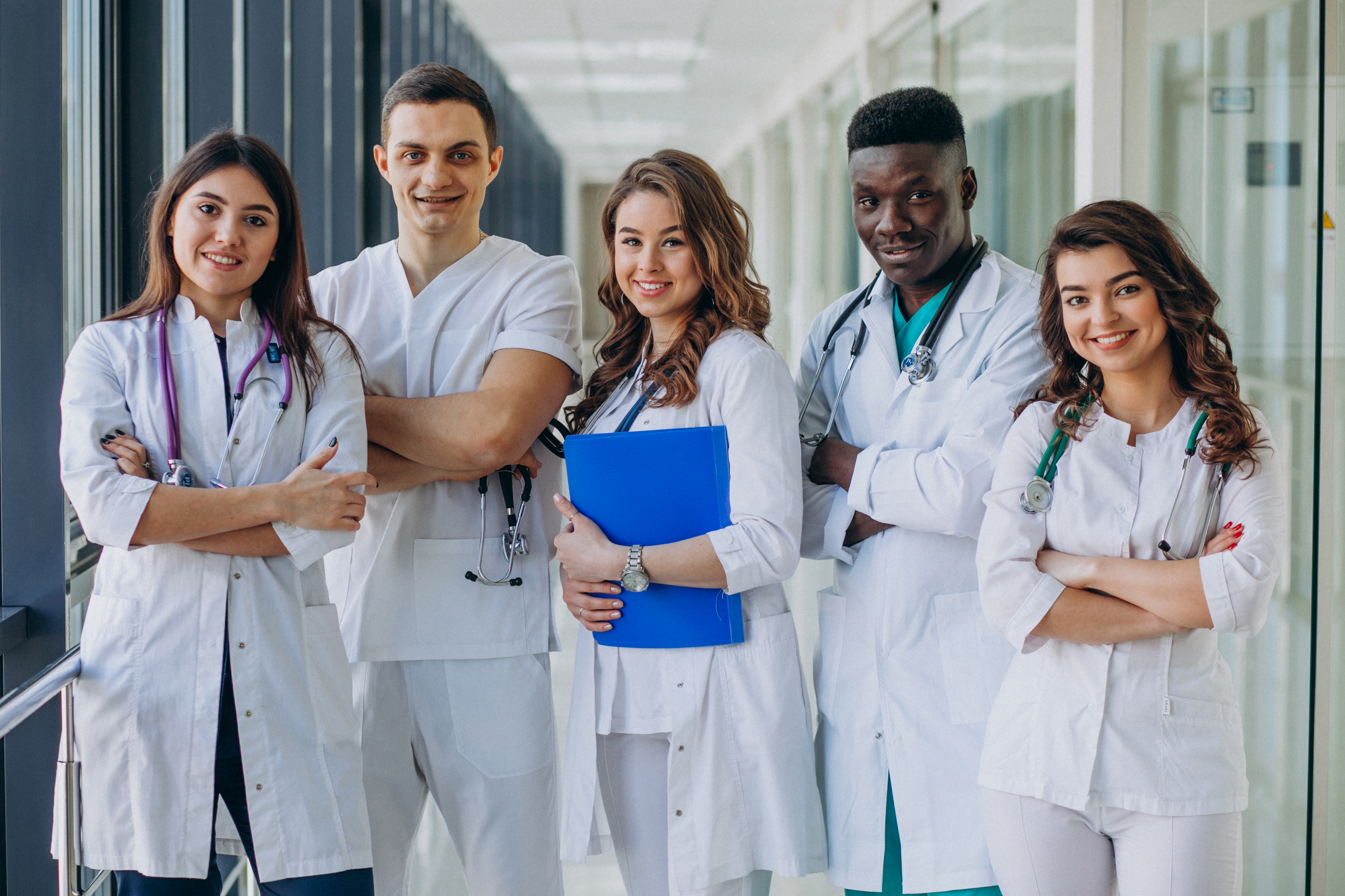 Ateam-young-specialist-doctors-standing-corridor-hospital